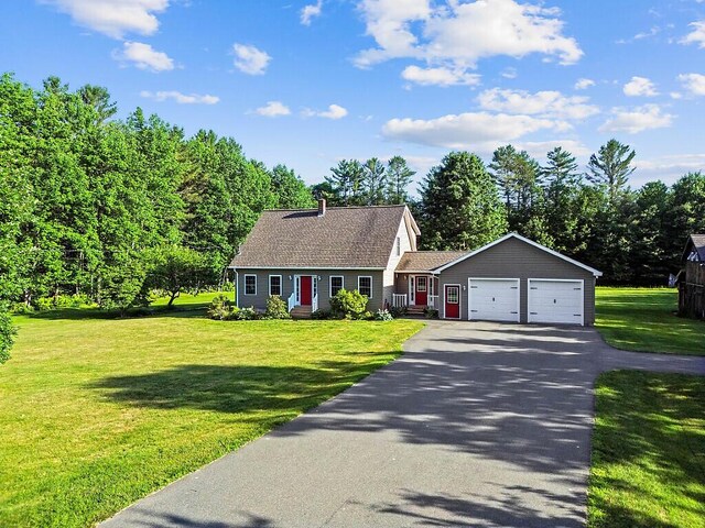 34 Cari Way, Sidney, ME 04330 - new england style home featuring asphalt driveway, an attached garage, and a front yard