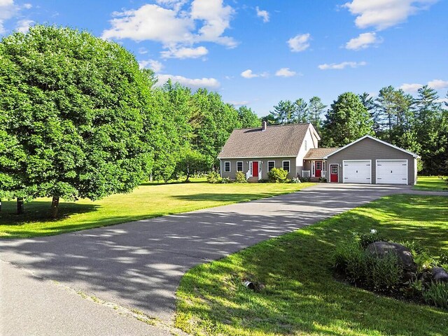 34 Cari Way, Sidney, ME 04330 - cape cod home featuring asphalt driveway, a front yard, and an attached garage
