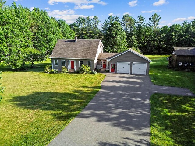 34 Cari Way, Sidney, ME 04330 - cape cod home featuring driveway, an attached garage, a front yard, and roof with shingles