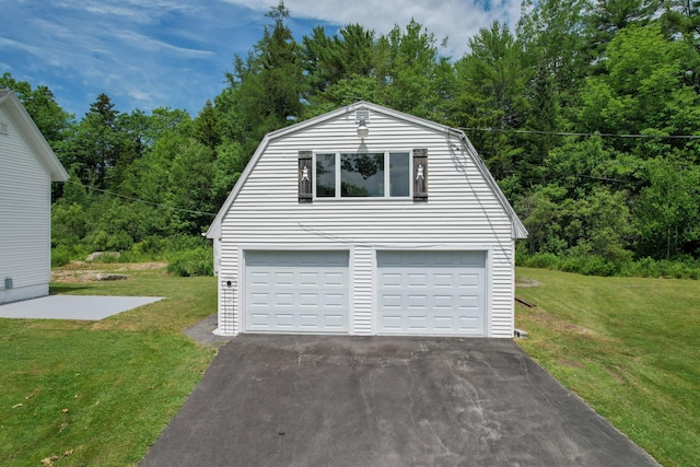 10 Jones Way, Sullivan, ME 04664 - garage featuring a wooded view and driveway