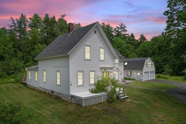 10 Jones Way, Sullivan, ME 04664 - view of side of home featuring an outbuilding, a shingled roof, a chimney, and a yard