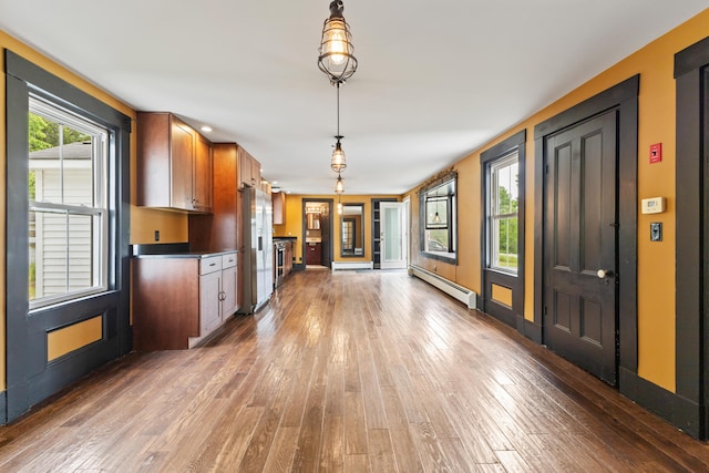 10 Jones Way, Sullivan, ME 04664 - kitchen featuring a baseboard heating unit, refrigerator with ice dispenser, hardwood / wood-style floors, and pendant lighting