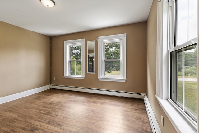 10 Jones Way, Sullivan, ME 04664 - unfurnished room featuring a baseboard heating unit and wood finished floors