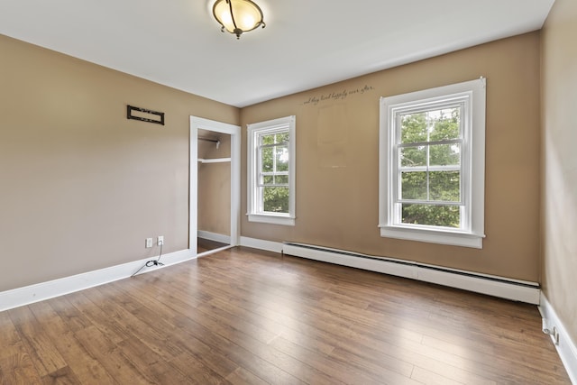 10 Jones Way, Sullivan, ME 04664 - unfurnished room featuring a baseboard heating unit and wood finished floors