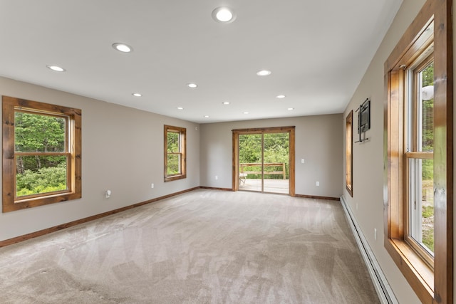 10 Jones Way, Sullivan, ME 04664 - spare room featuring light carpet, recessed lighting, and a baseboard radiator