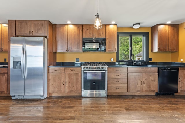 10 Jones Way, Sullivan, ME 04664 - kitchen featuring black appliances, dark countertops, dark wood finished floors, recessed lighting, and hanging light fixtures