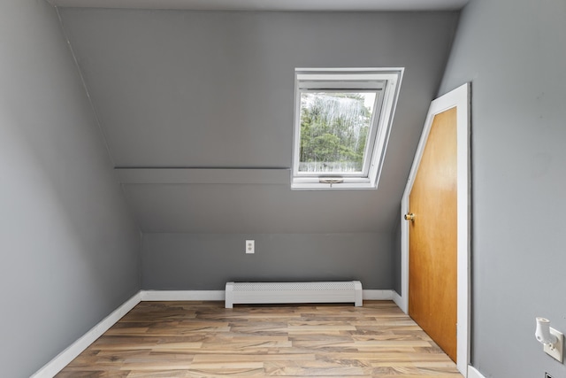 10 Jones Way, Sullivan, ME 04664 - spare room with wood finished floors, a baseboard heating unit, and lofted ceiling