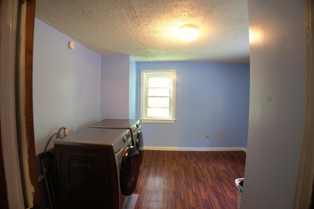 199 Middle Rd, Bradford, ME 04410 - laundry area with washing machine and dryer, a textured ceiling, and dark wood finished floors