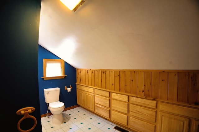 199 Middle Rd, Bradford, ME 04410 - bathroom featuring vaulted ceiling and wooden walls