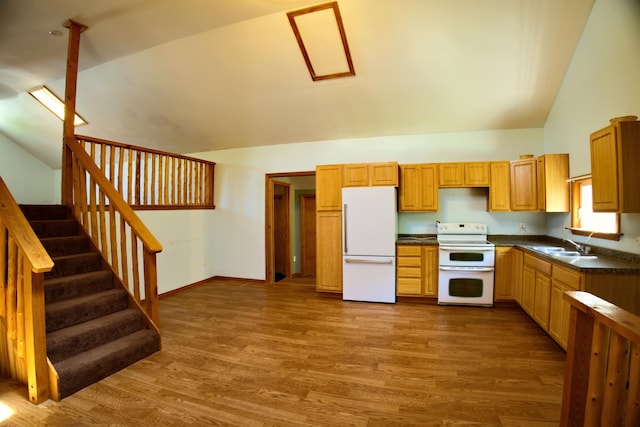 199 Middle Rd, Bradford, ME 04410 - kitchen with white appliances, lofted ceiling, dark countertops, and dark wood finished floors