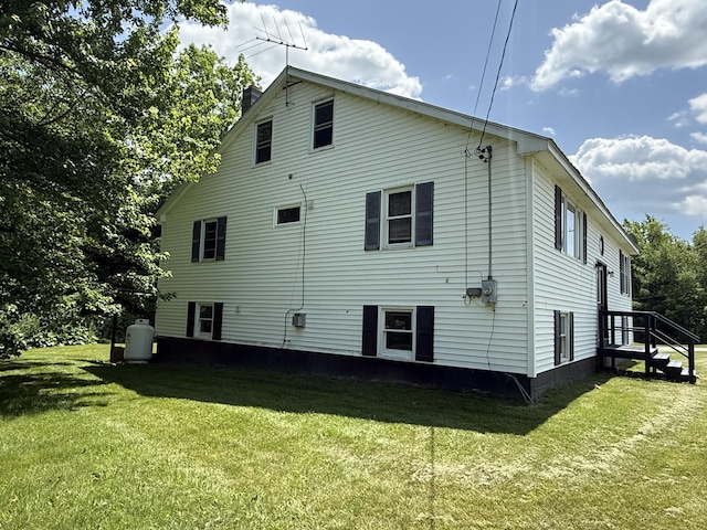 199 Middle Rd, Bradford, ME 04410 - rear view of house with a lawn and a chimney