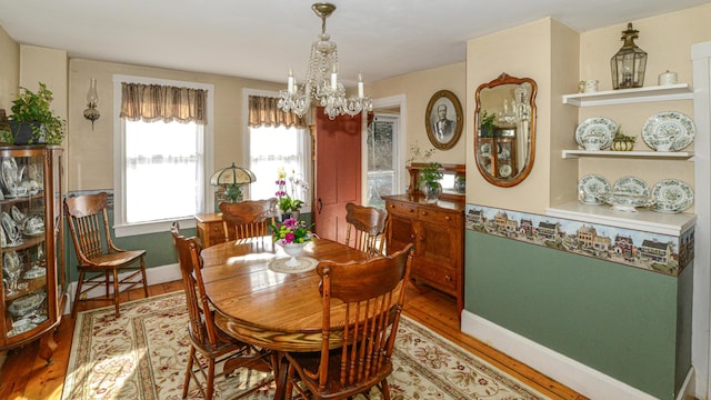 133 Hio Ridge Rd, Bridgton, ME 04009 - dining area with a chandelier and light wood-style flooring