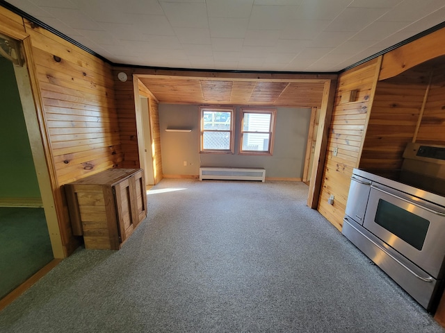 67 Stevens St, Lewiston, ME 04240 - unfurnished living room with wood walls, baseboard heating, and carpet flooring