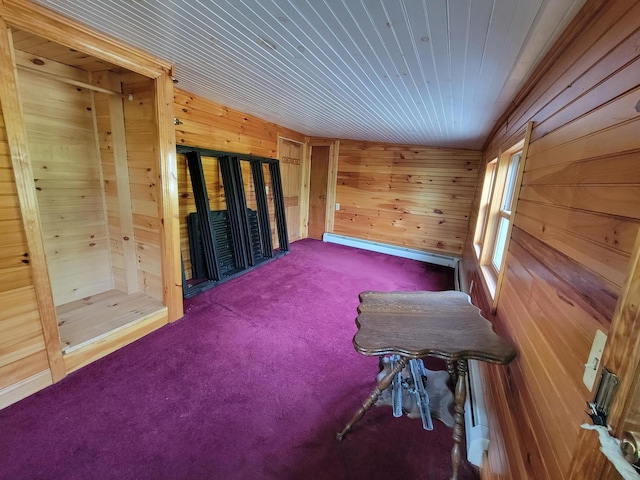 67 Stevens St, Lewiston, ME 04240 - carpeted empty room featuring wooden walls, a baseboard radiator, and wood ceiling