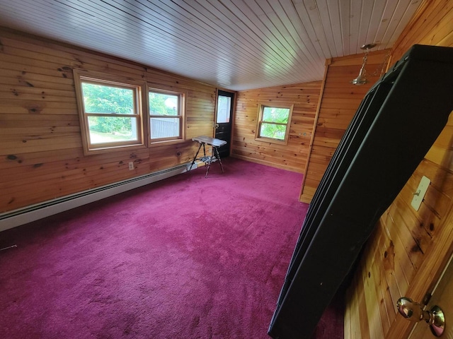 67 Stevens St, Lewiston, ME 04240 - empty room with wood walls, healthy amount of natural light, a baseboard radiator, wood ceiling, and carpet floors