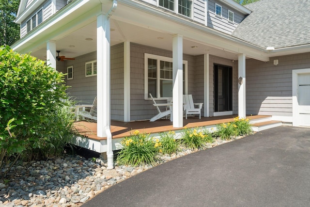 65 Wildbrook Ln, Eliot, ME 03903 - doorway to property with a shingled roof and covered porch