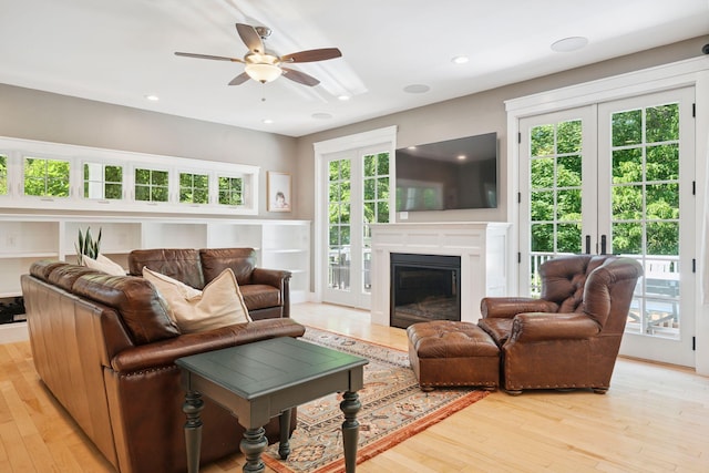 65 Wildbrook Ln, Eliot, ME 03903 - living area with a ceiling fan, light wood-type flooring, a glass covered fireplace, and recessed lighting