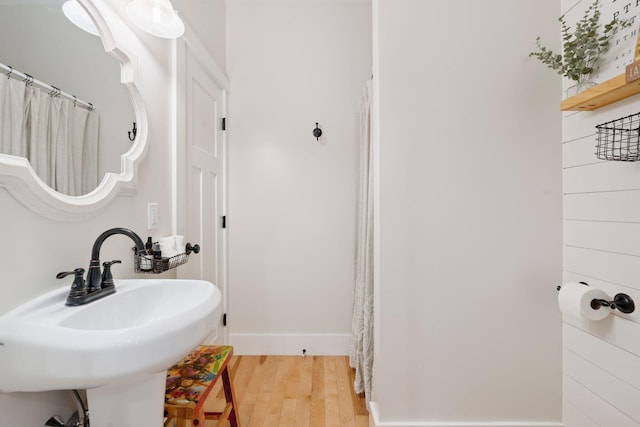 65 Wildbrook Ln, Eliot, ME 03903 - bathroom with wood finished floors and a shower with shower curtain