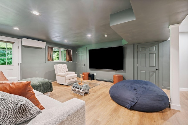 65 Wildbrook Ln, Eliot, ME 03903 - living room with an AC wall unit, wood finished floors, plenty of natural light, and recessed lighting