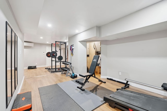 65 Wildbrook Ln, Eliot, ME 03903 - exercise area with a wall mounted AC, wood finished floors, and recessed lighting