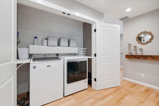 65 Wildbrook Ln, Eliot, ME 03903 - laundry room with independent washer and dryer and light wood-style floors