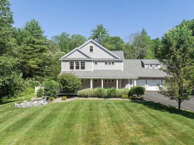 65 Wildbrook Ln, Eliot, ME 03903 - shingle-style home featuring a front lawn, a shingled roof, and a porch