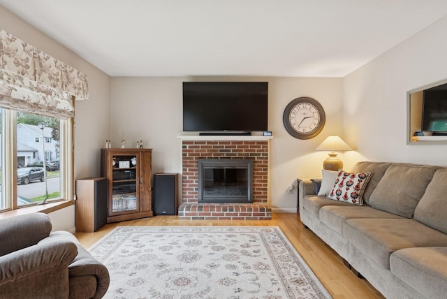 66 Rustic Ln, Portland, ME 04103 - living room with wood finished floors and a fireplace