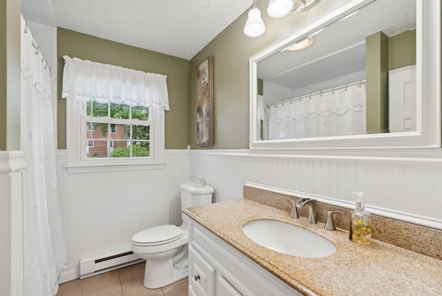 66 Rustic Ln, Portland, ME 04103 - full bathroom featuring a baseboard heating unit, vanity, wainscoting, tile patterned flooring, and a textured ceiling