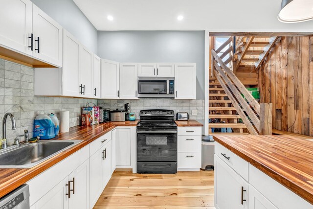 17 Applehead Way, Orrington, ME 04474 - kitchen featuring butcher block countertops, stainless steel appliances, backsplash, white cabinets, and recessed lighting