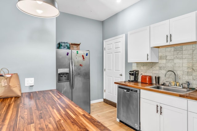 17 Applehead Way, Orrington, ME 04474 - kitchen featuring stainless steel appliances, wooden counters, tasteful backsplash, white cabinets, and light wood-style floors