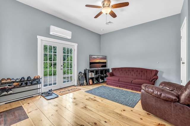 17 Applehead Way, Orrington, ME 04474 - living area with french doors, a wall mounted AC, hardwood / wood-style flooring, and a ceiling fan