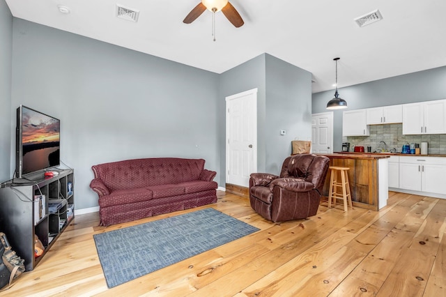17 Applehead Way, Orrington, ME 04474 - living area with ceiling fan and light wood-type flooring