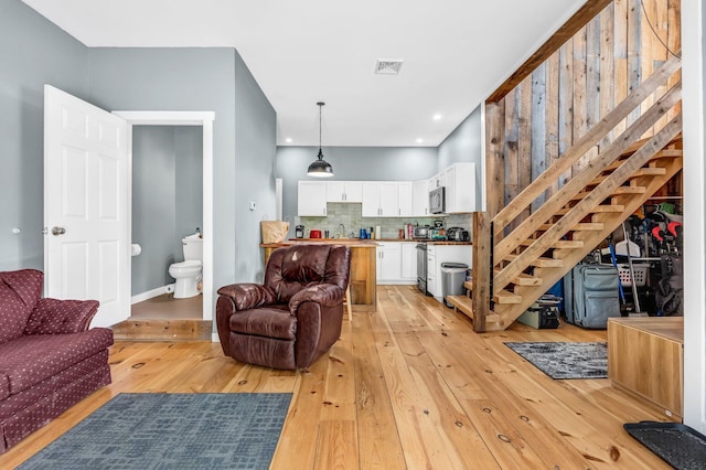 17 Applehead Way, Orrington, ME 04474 - living area with light wood-type flooring and stairs