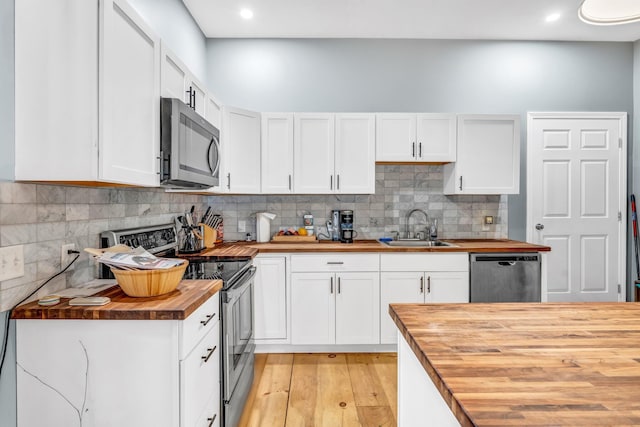 17 Applehead Way, Orrington, ME 04474 - kitchen featuring wood counters, appliances with stainless steel finishes, light wood-style floors, decorative backsplash, and recessed lighting