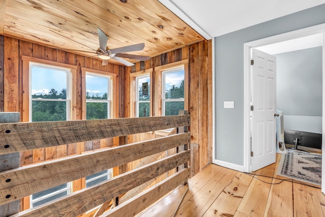 17 Applehead Way, Orrington, ME 04474 - bathroom featuring healthy amount of natural light, a ceiling fan, hardwood / wood-style floors, and wooden walls