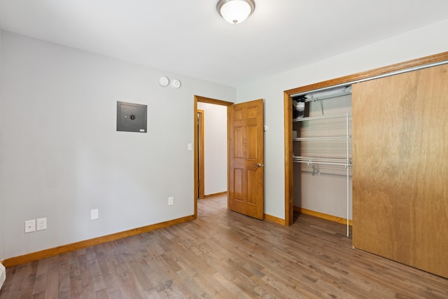 2288 W River Rd, Sidney, ME 04330 - unfurnished bedroom with a closet and wood finished floors