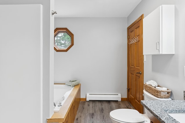 2288 W River Rd, Sidney, ME 04330 - full bath featuring baseboard heating, wood finished floors, a bath, and vanity