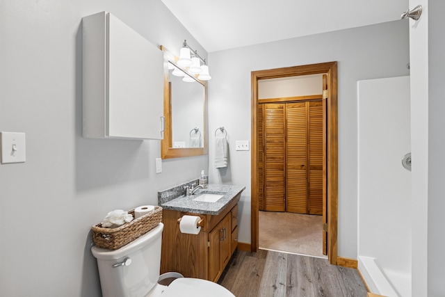 2288 W River Rd, Sidney, ME 04330 - bathroom featuring wood finished floors, vanity, and a closet