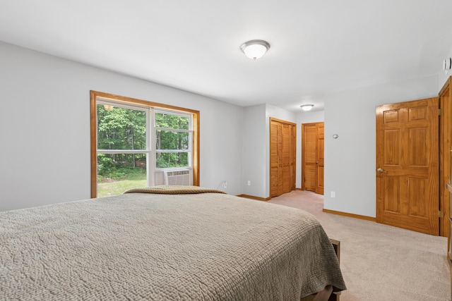 2288 W River Rd, Sidney, ME 04330 - bedroom with light colored carpet, cooling unit, and a closet