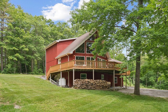 2288 W River Rd, Sidney, ME 04330 - back of property featuring a wooden deck and a yard