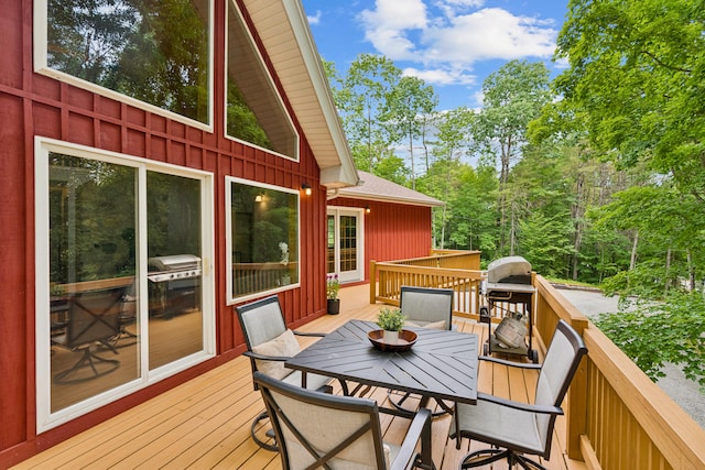 2288 W River Rd, Sidney, ME 04330 - deck with outdoor dining area and a grill