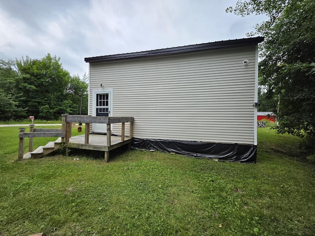 17 Cross St, Kingman Twp, ME 04451 - view of property exterior featuring a deck and a yard