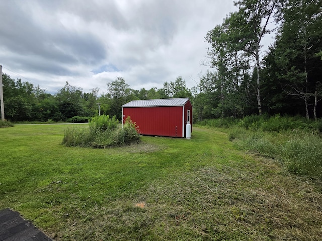 17 Cross St, Kingman Twp, ME 04451 - view of grassy yard with a shed