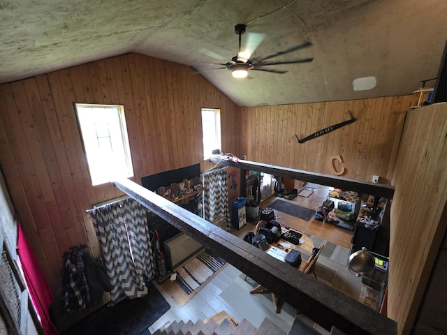 17 Cross St, Kingman Twp, ME 04451 - stairs featuring vaulted ceiling, wood walls, wood finished floors, and ceiling fan