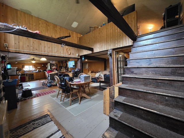 17 Cross St, Kingman Twp, ME 04451 - dining area with wooden walls, stairs, and wood-type flooring