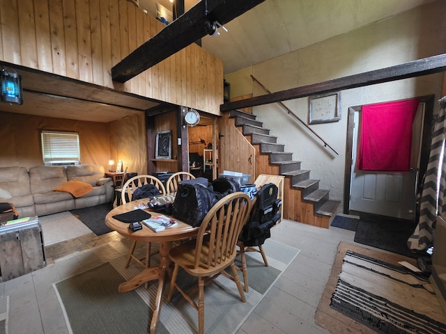 17 Cross St, Kingman Twp, ME 04451 - dining area featuring wood walls, stairs, and hardwood / wood-style flooring
