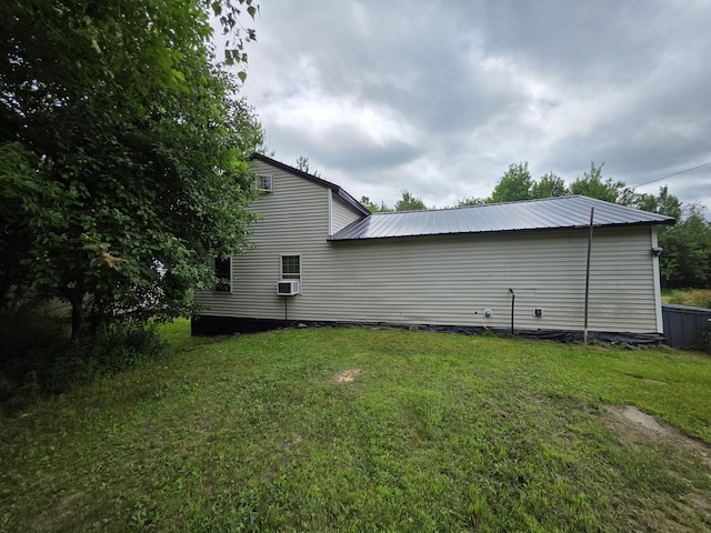17 Cross St, Kingman Twp, ME 04451 - view of property exterior featuring a yard and a metal roof
