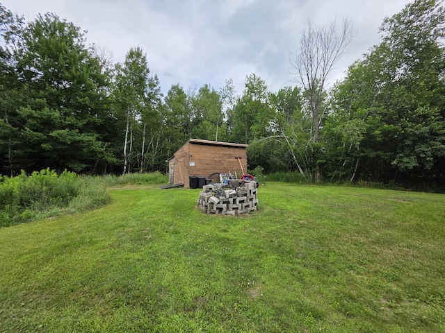 17 Cross St, Kingman Twp, ME 04451 - view of green lawn featuring a storage shed