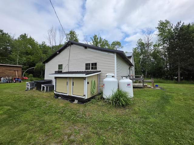 17 Cross St, Kingman Twp, ME 04451 - view of side of property with a yard and a shed