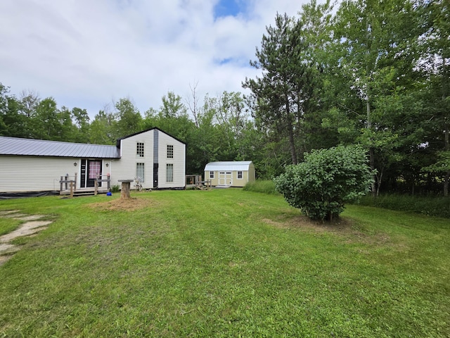 17 Cross St, Kingman Twp, ME 04451 - view of green lawn with a shed